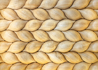 Traditional ecological consistent cladding of a wall with brown wooden larch fish scales, wood...