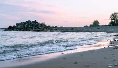 Coastline in the sunset lights with focus on the details. Shallow depth of field. Selective focus.