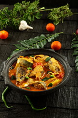 Kerala food recipes, delicious mango, coc0oinut milk creamy fish curry.