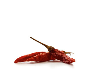 Dry red hot chili peppers on white background