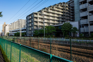 residencial builidings alond side of the railway of jr east in tokyo, japan