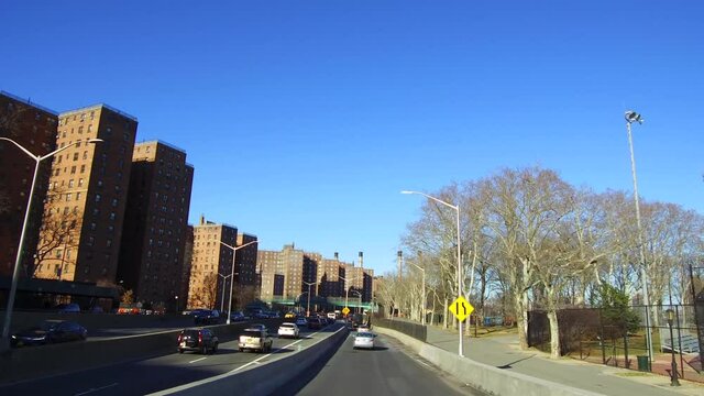 Driving on FDR Drive in New York City and Passing New York Public Housing