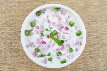 Indian raitha , cucumber, onion, tomato salad with curd cream.