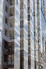Residential complex, multi-storey residential building - transparent windows of glazed balconies