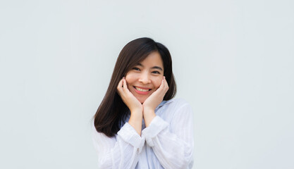 close up attractive adult business woman asian girl with happy and smile against white concrete wall office.
