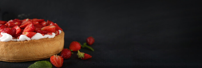 Tasty strawberry pie on black background with space for text