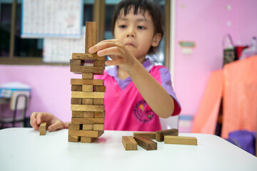 Hearing impaired children Playing wooden blocks game