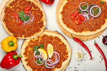 Boards with delicious Turkish pizza on light background