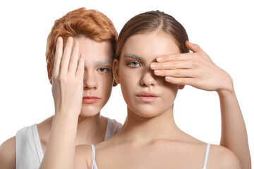 Teenagers with dyed eyebrows on white background