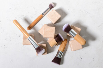 Obraz na płótnie Canvas Set of makeup brushes with decor on white background