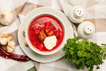 Composition with tasty borscht on fabric background