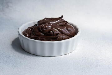 Cocoa spread food photo. Brown chocolate paste on white background