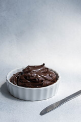 Cocoa spread food photo. Brown chocolate paste on white background