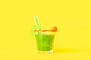 Glass of bloody Mary cocktail on color background