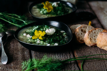 Okroshka in a black plate. Cold soup