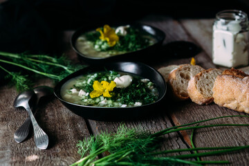 Okroshka in a black plate. Cold soup