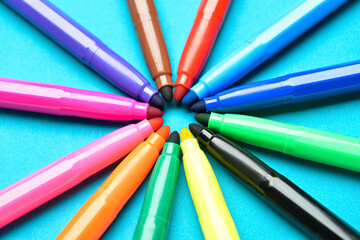 Colorful markers on color background © Pixel-Shot
