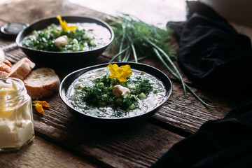 Okroshka in a black plate. Cold soup