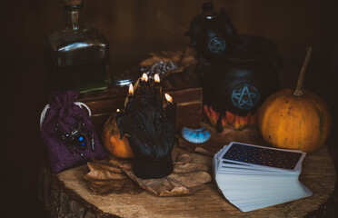 Candle burns on the altar, magic among candles, clean energy, magical concept, autumn time	