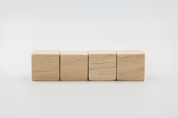 Four blank wooden block cubes on a white background for your text.