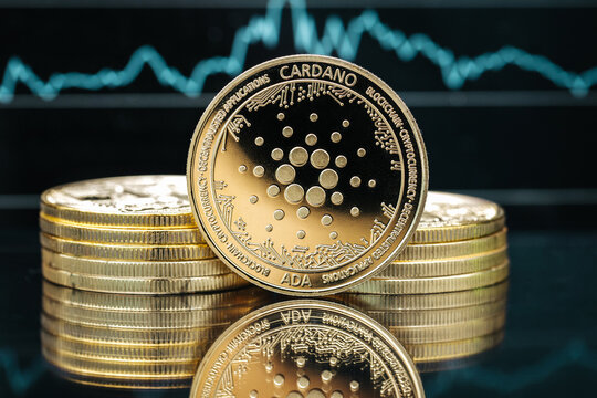 Cardano Ada cryptocurrency coin close-up, in front of a price chart