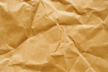 Brown crumpled paper recycled kraft sheet texture background