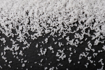 White pvs granules on black background