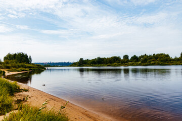 Sunset at the river coast. Smooth water at river