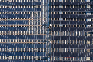 Solar panels on an industrial roof, Aerial view.