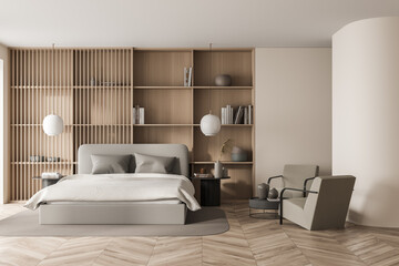 Bright bedroom interior with large bed, two armchairs