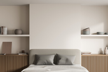 View of bed headboard area in beige bedroom