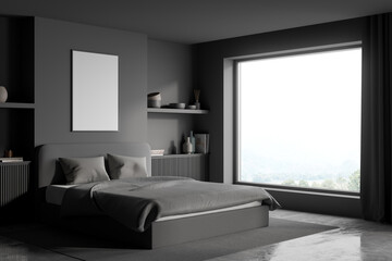 Corner view of a modern grey bedroom with a poster