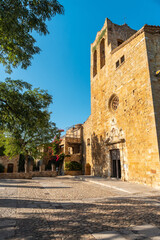 Fototapeta na wymiar Church of Pals medieval village, streets of the historic center at sunset, Girona on the Costa Brava of Catalonia in the Mediterranean