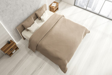 Top view of beige bed in white wood bedroom