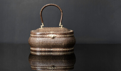 handmade woven bag, wicker bag pattern and taxture brown color. Bag made from nature plants Lygodium. Produced in the southern region thailand.