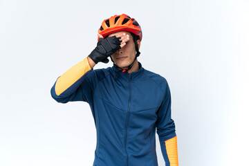 Young cyclist man isolated on background covering eyes by hands. Do not want to see something