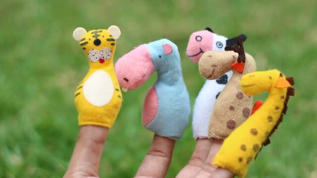 hand with finger puppet theatre.  Performance in the kindergarten. Funny puppet show, theater.