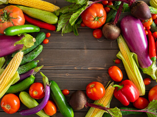 frame made of vegetables on the table top view, vegetable food background with empty space in the center, template background flat lay of various types of vegetables, Sustainable Market Farming
