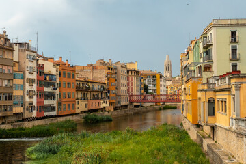 Girona medieval city, traditional colored houses on the dry river Onyar in summer, Costa Brava of Catalonia in the Mediterranean. Spain