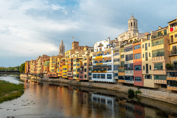 Fototapeta na wymiar Girona medieval city, panoramic from the famous red bridge Pont de les Peixateries Velles, Costa Brava of Catalonia