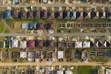 Construction of a suburban neighborhood of cottages. Aerial view