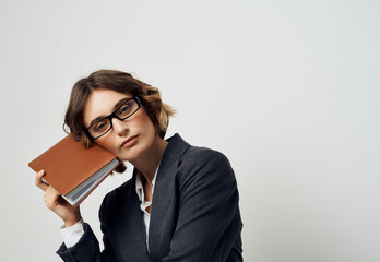woman in business suit documents in hand executive office