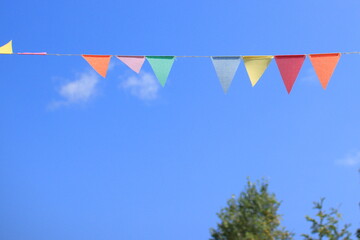 colorful flags on the blue sky