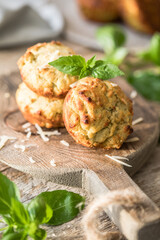 Homemade unsweetened savory appetizer cupcakes with ham, cheese, pesto.