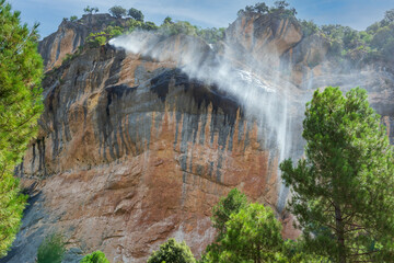 Waterfall blown by the wind on the path of the Borosa river, Sierra de Cazorla
