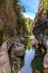 Fototapeta na wymiar Cerrada de Elias (Elias Canyon), a wooden overpass over the Borosa river in the Sierra de Cazorla.