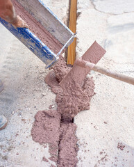 Filling with colored concrete of excavation with a narrow section for the implementation of a fiber...