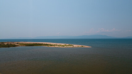 Fototapeta na wymiar Panoramic drone clip of a small tropical peninsula in Strimonas, Macedonia, North Greece