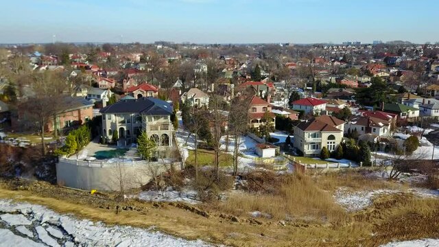 View of Waterfront Homes During the Winter in Queens - Slider Shot