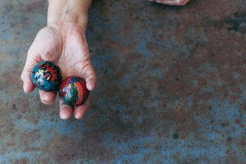 hands of senior adult woman excercising with chinese baoding balls for stress relief and deep...